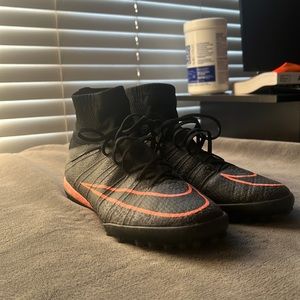 Black and orange Nike mercurial turf superflys